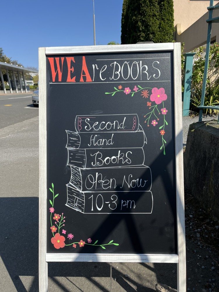 WE Are Books sandwich board outside the CWEA villa